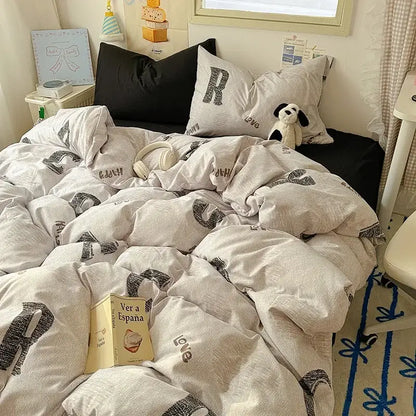 Cozy off-white cotton fitted sheet set with bold black love graphic print from cartoon dog and cupcake bedroom bedding