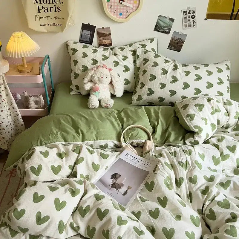 Green heart-patterned bedding set with soft cotton material and white base from decorbites cartoon style comforter set