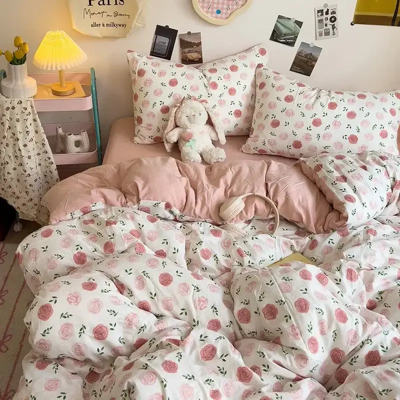 Cream comforter bedding set with pink rose patterns and green leaf accents in decorbites cartoon style for bedroom