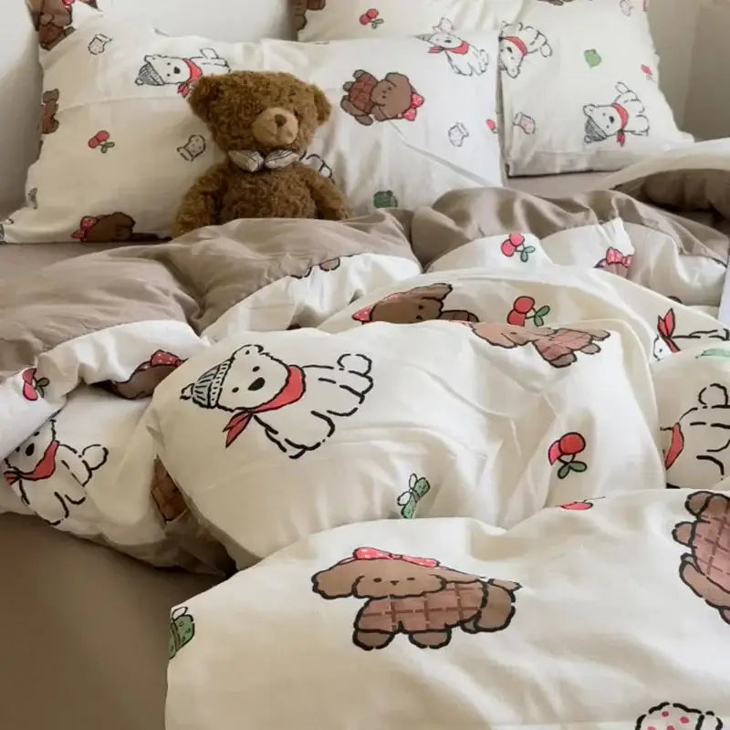 A plush brown teddy bear with a white bow tie on a cream comforter bedding set featuring cartoon dog prints decorbites cartoon style