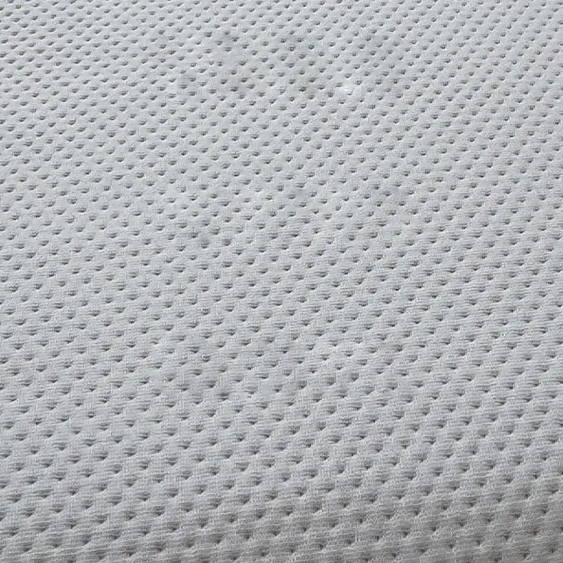 Light gray breathable mesh fabric with small raised dots on the back side of decorbites cartoon embroidered fitted sheet