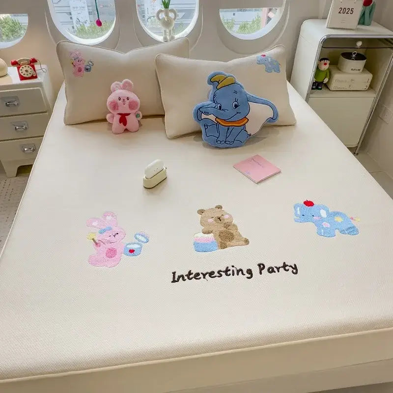 Cream-colored decorbites cartoon embroidered fitted sheet featuring embroidered characters and interesting party text
