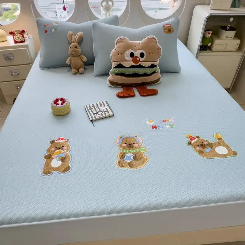 Light blue decorbites cartoon embroidered fitted sheet with bear-themed patches and plush hamburger pillow on mattress pad