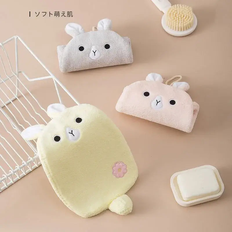 Soft plush bunny-shaped bath sponge in pastel yellow with embroidered face and flower patch for decorbites cartoon embroidery hand towel decor