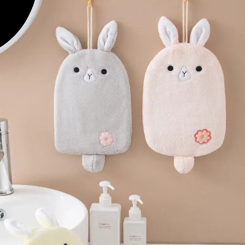 Two plush hand towels in gray and blush pink with decorbites cartoon embroidery hanging design for kitchen use
