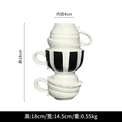 Stacked ceramic folding cups with a bold black and white vertical striped decorbites cartoon folding cup for living room decor