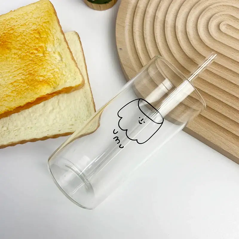 Clear glass cup with integrated straw featuring minimalist black marshmallow drawing and um text decorbites cartoon glass cup