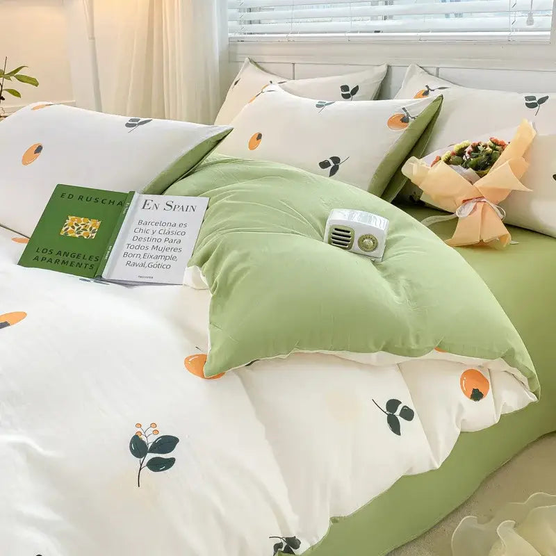 Green and white duvet set with cartoon heart floral cream and gray botanical print featuring orange fruit motifs
