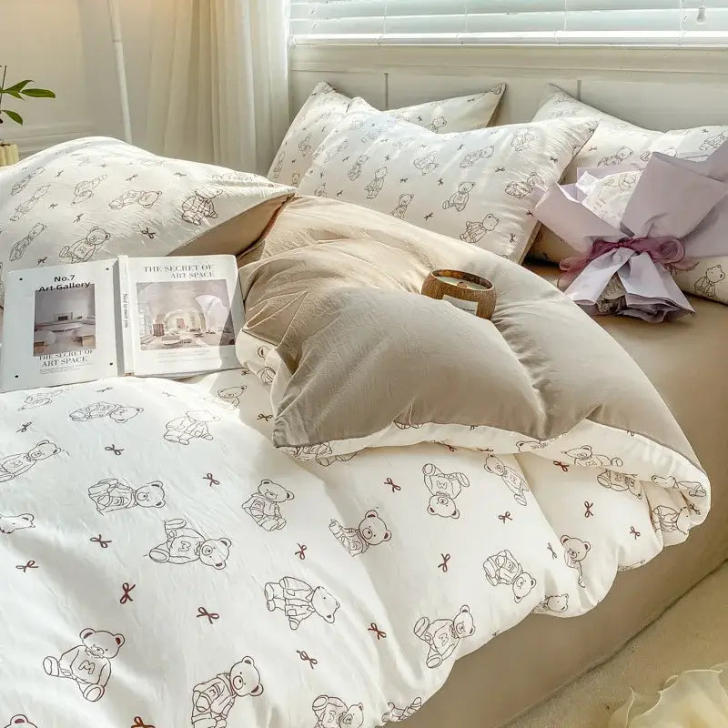 White duvet set with small teddy bears and bows in soft brown ink paired with beige pillowcases for cozy bedroom cartoon heart floral design