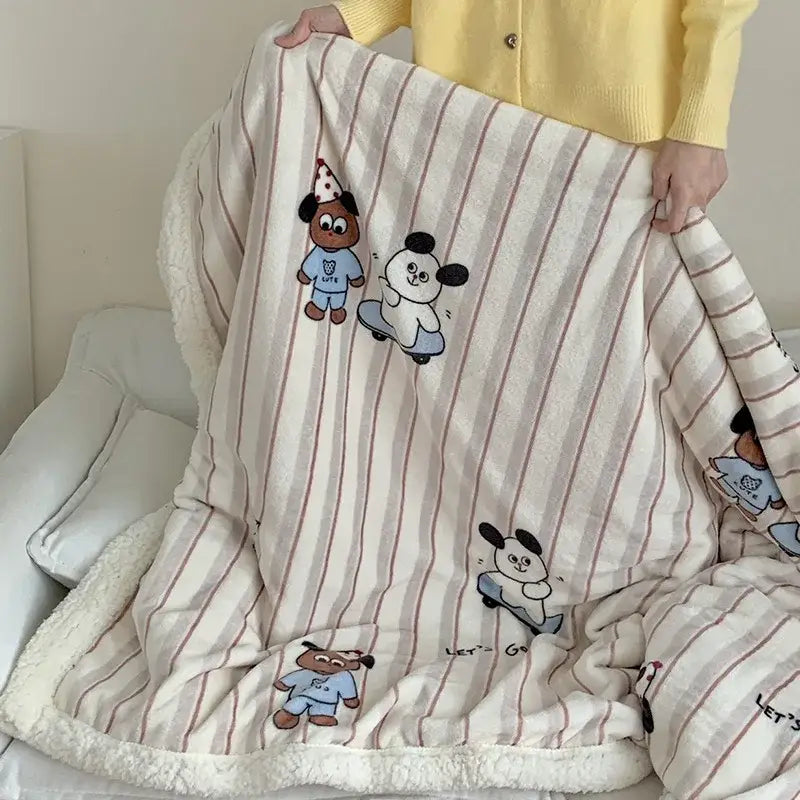 A cozy cream cartoon lamb wool blanket with soft stripes and plush white fleece lining for pink floral bedroom decor