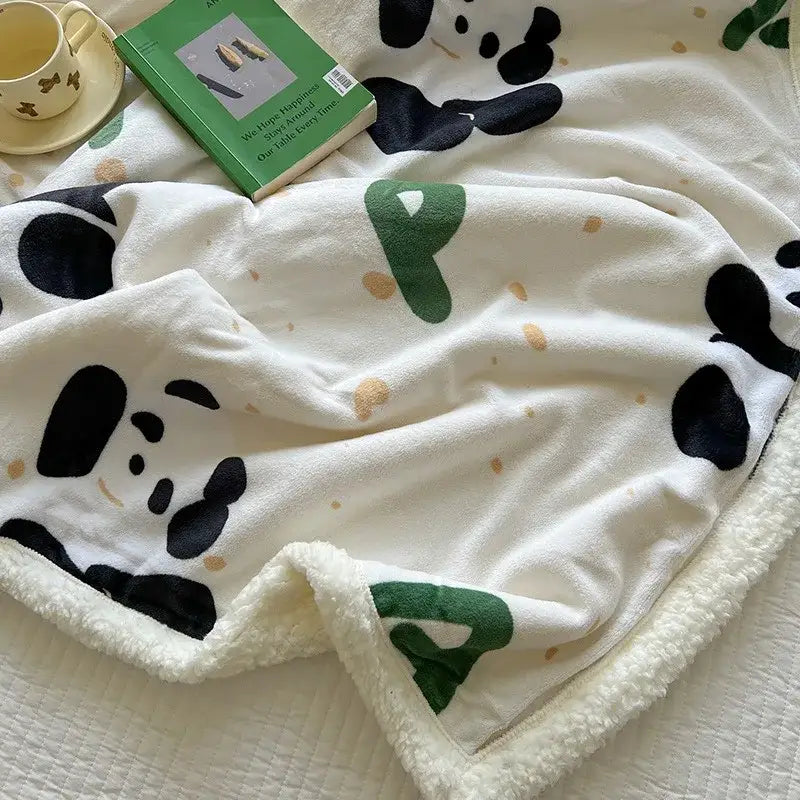 White plush cartoon lamb wool blanket with black panda faces green letter p accents soft fleece bedroom throw