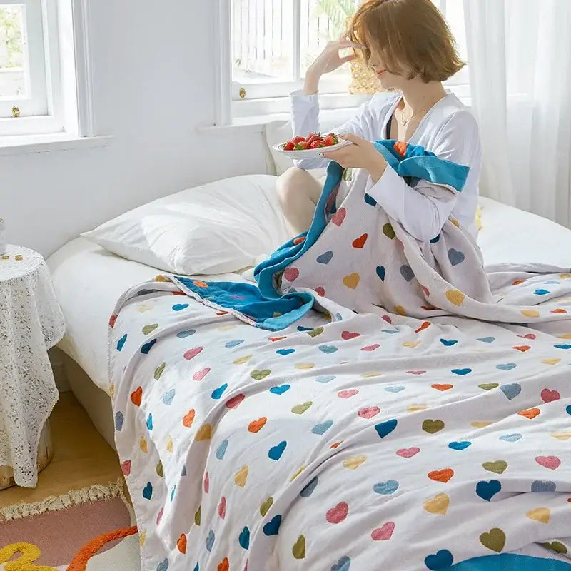 Cozy cartoon lion cotton throw with plush multicolored heart pattern and bright blue border for decorbites bedroom decor