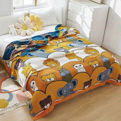 A cozy cartoon lion cotton throw blanket in yellow and gray featuring playful lion and animal patterns for decorbites