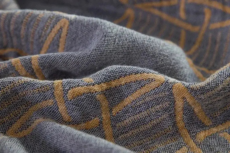 Gray fabric of decorbites cartoon lion cotton throw blanket with golden brown woven abstract lines for bedroom decor
