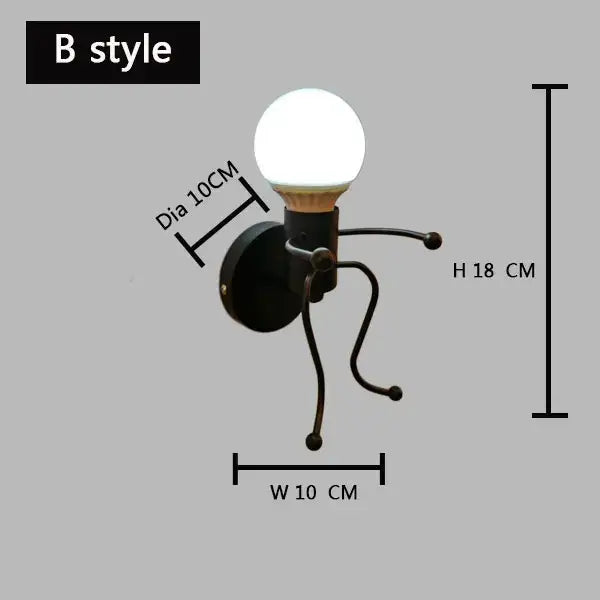 Black metal wall lamp with round white bulb and articulated limbs in decorbites cartoon matchstick man design for kids room