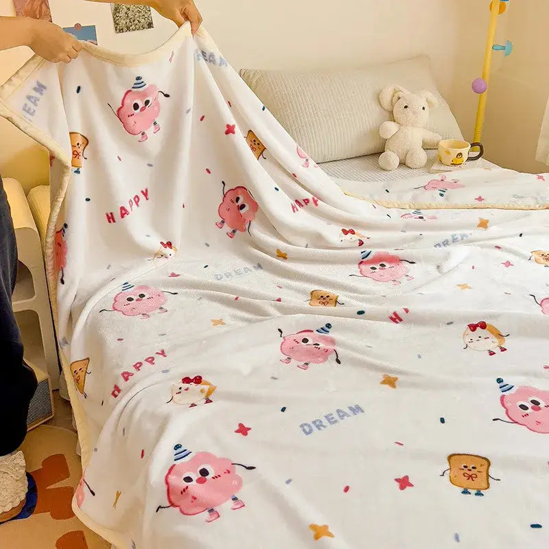 White plush cartoon milk velvet blanket with pink characters and colorful happy and dream text for cozy decorbites decor