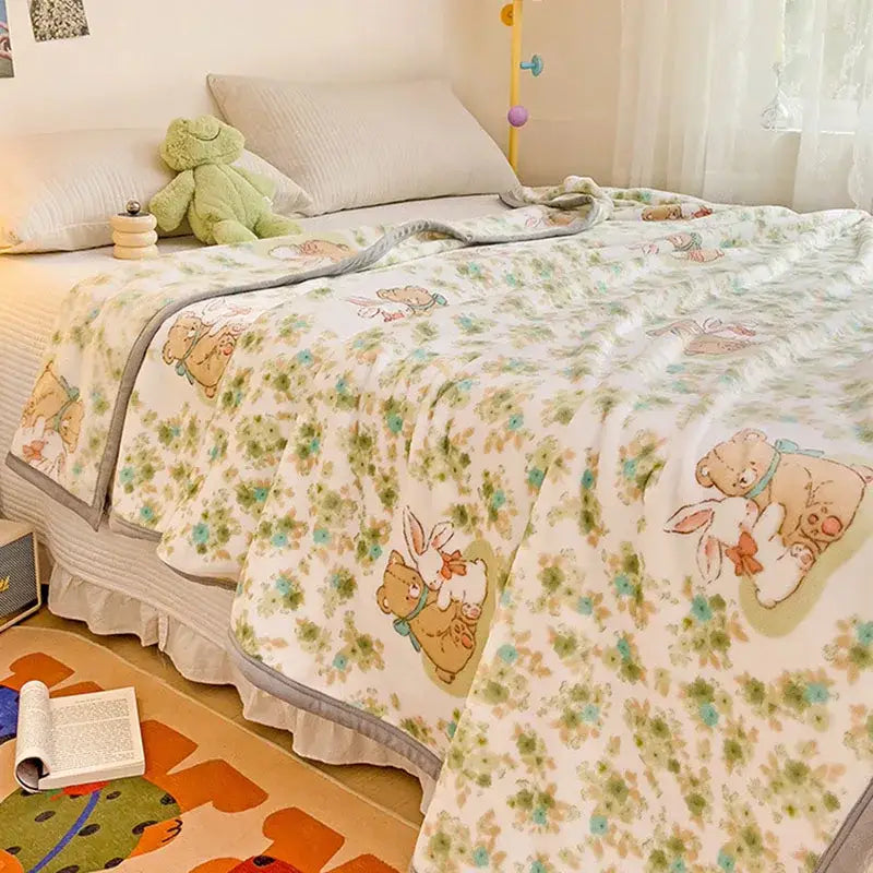 A cream-colored cartoon milk velvet teddy bear blanket with floral motifs and gray ruffled border for bedroom decorbites cartoon milk