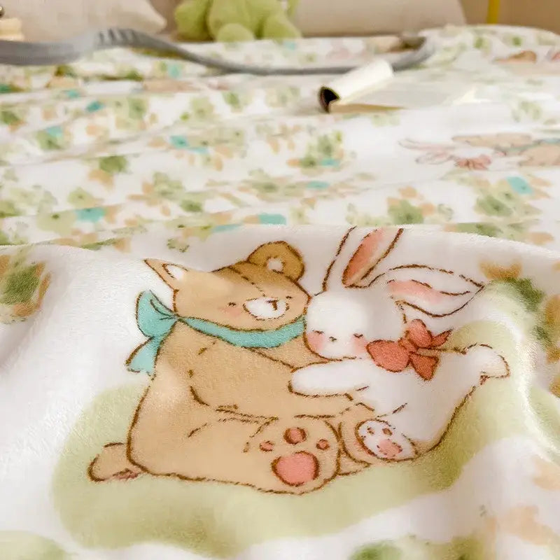 Soft white cartoon milk velvet teddy bear blanket with tan bear and pink-bowed rabbit on green decorbites cartoon milk design