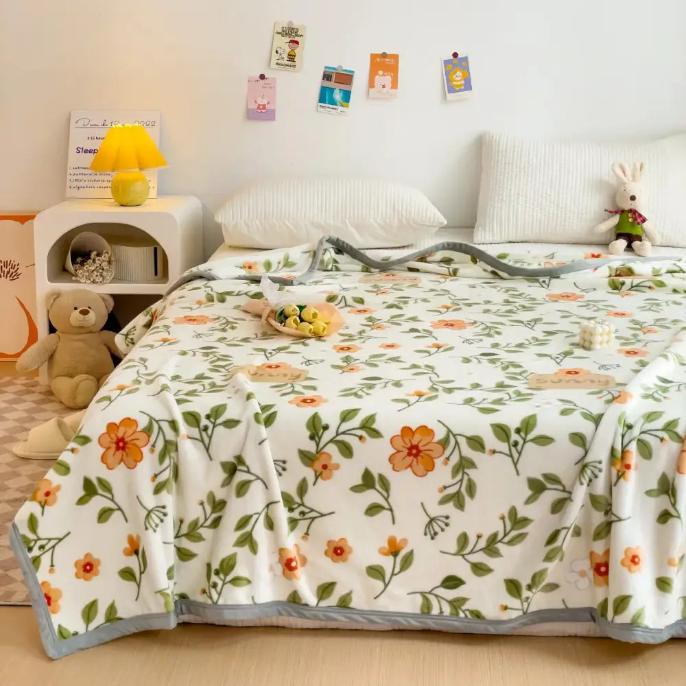 Cartoon milk velvet teddy bear blanket white floral fleece with orange and green blossoms and soft gray edging