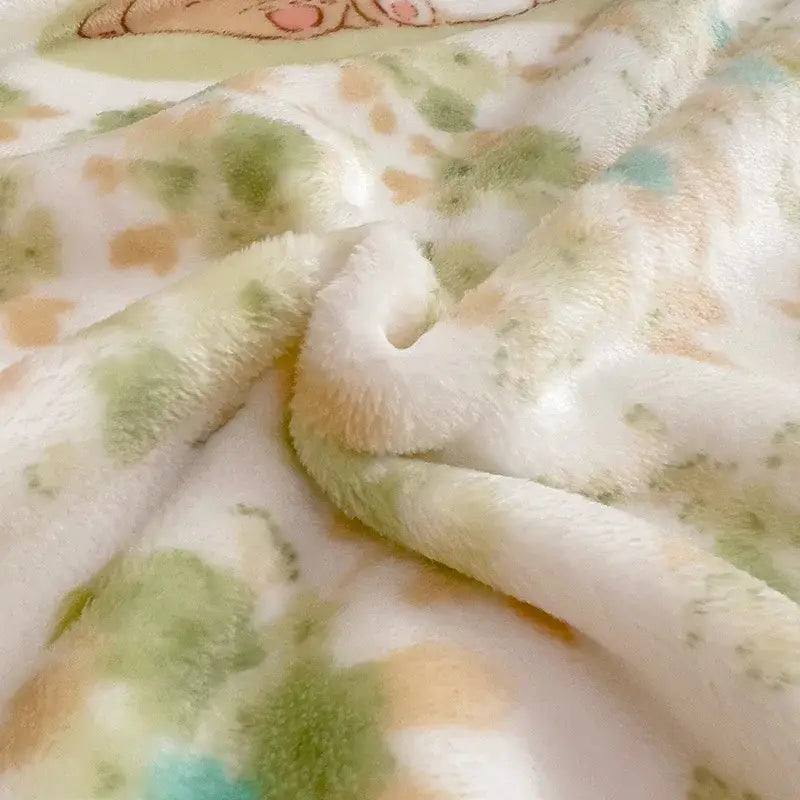Soft white cartoon milk velvet teddy bear blanket with green and peach floral pattern for cozy bedroom decorbites decor