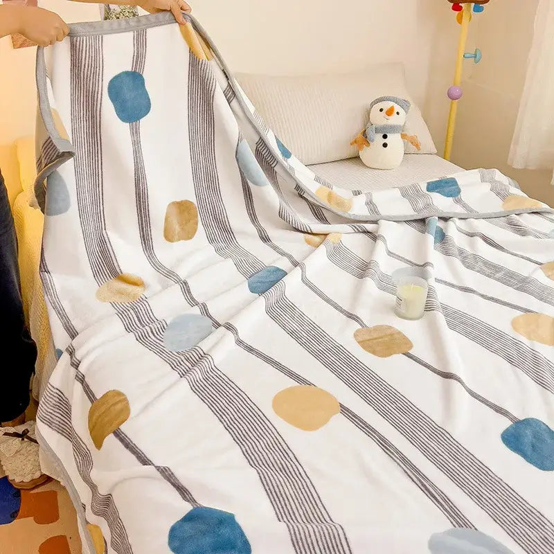 A cozy cartoon milk velvet teddy bear blanket in white with gray stripes and blue beige patterns for bedroom decorbites decor