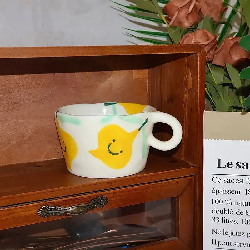 White ceramic cartoon pattern ceramic coffee mug with cheerful yellow pear illustrations and light green accents