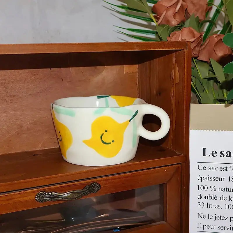 White ceramic mug from decorbites cartoon pattern ceramic mug set featuring a cheerful yellow pear with green accents