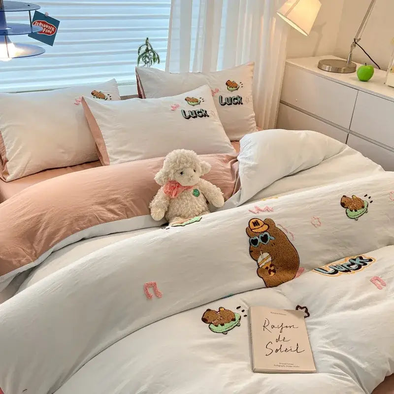 White duvet cover with cartoon pattern embroidered brown bear and pink musical notes from decorbites bedding sets