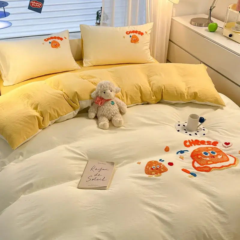 Yellow cheese-themed bedding sets with decorbites cartoon pattern embroidered characters and orange accents for bedroom decor