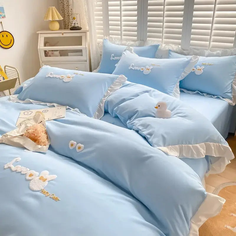 Light blue and white bedding set with ruffled edges and embroidered bunny design from decorbites cartoon princess collection