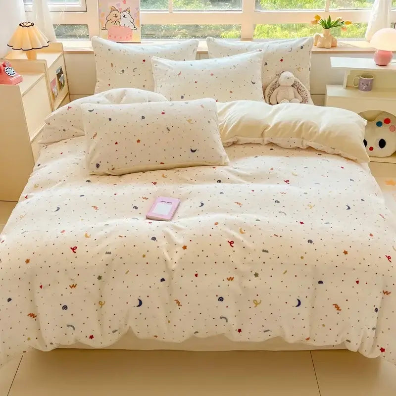 Cream-colored soft cotton bedding set with pastel cartoon print stars moons hearts for decorbites cartoon print collection
