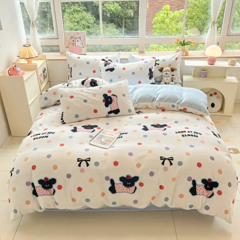 White cotton bedding set with decorbites cartoon print of black dogs in pink outfits and colorful polka dots