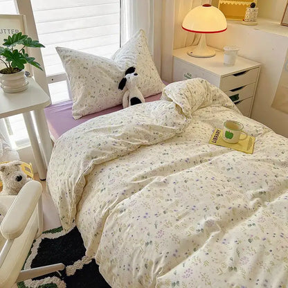 Cream-colored decorbites cartoon printed bedding sets with pastel floral patterns in soft cozy fabric for bedroom use