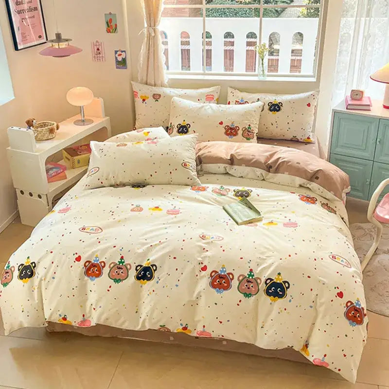Cream-colored cartoon printed cotton duvet cover featuring playful bears in festive hats and colorful confetti decorbites