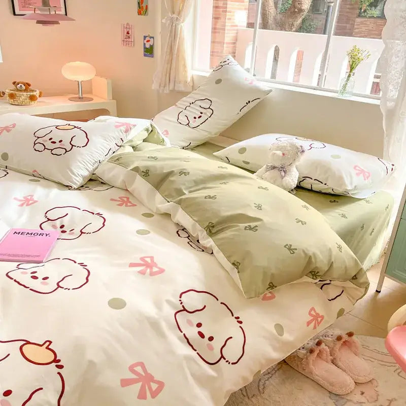 Cute pastel green and white cartoon printed cotton duvet cover with puppy faces and pink bows in decorbites set