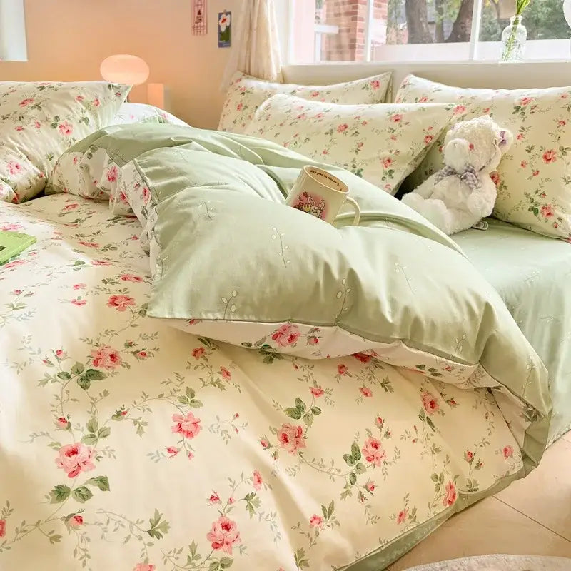 Pastel green and cream floral duvet cover with pink roses and vines made of cartoon printed cotton for bedroom decorbites