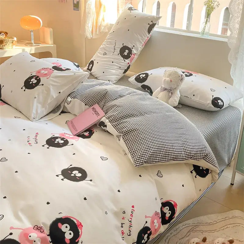 White cartoon printed cotton duvet cover in cream with black and pink decorbites cartoon printed characters and checkered pattern