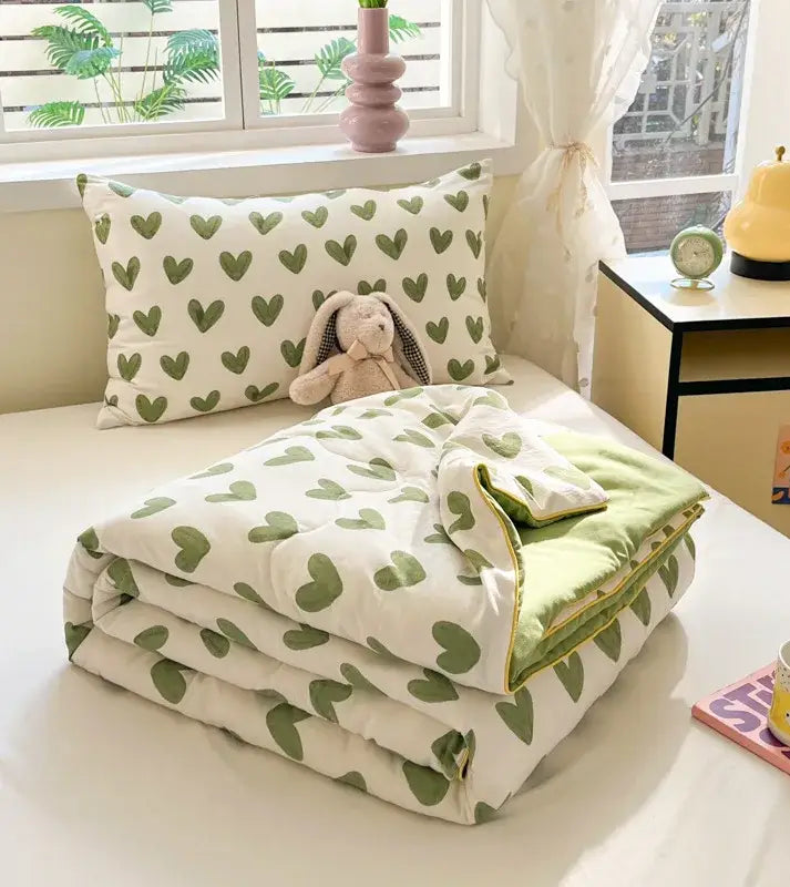 A cozy white and olive green heart-patterned quilt with plush texture for decorbites cartoon printed cooling blanket