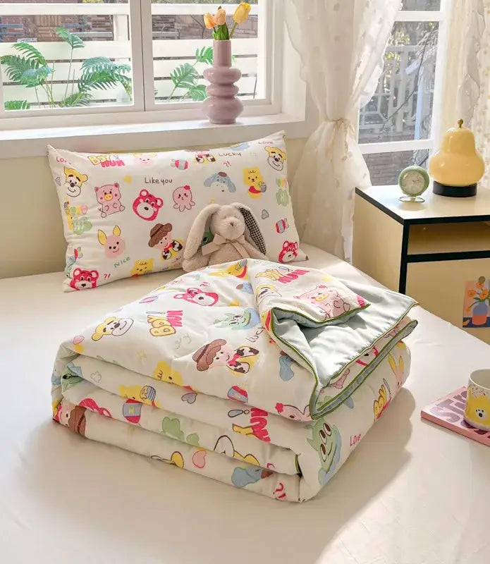 A cozy white and yellow cooling blanket with decorbites cartoon printed animals and soft fabric for summer use