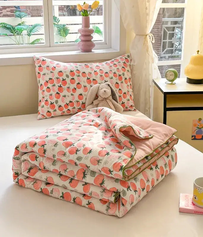 Pink tomato-patterned decorbites cartoon printed cooling blanket with soft cozy texture and neatly folded edges