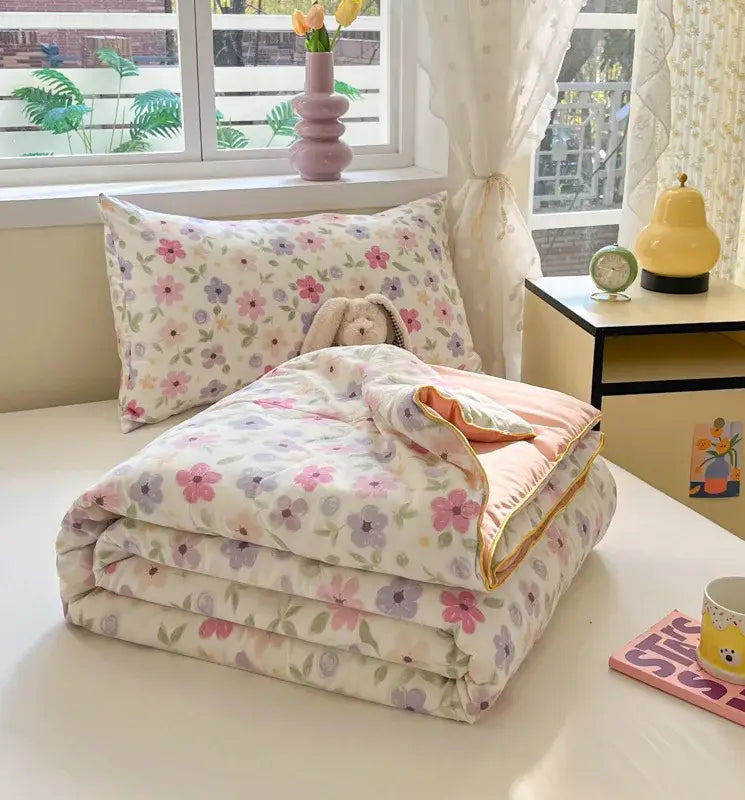 A soft cooling blanket with pastel floral pattern on cream background for decorbites cartoon printed summer use