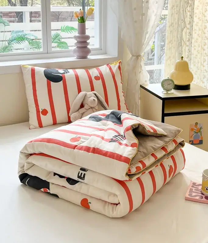 A cozy cooling blanket with bold red and white stripes and black orange fruit pattern from decorbites cartoon printed summer line