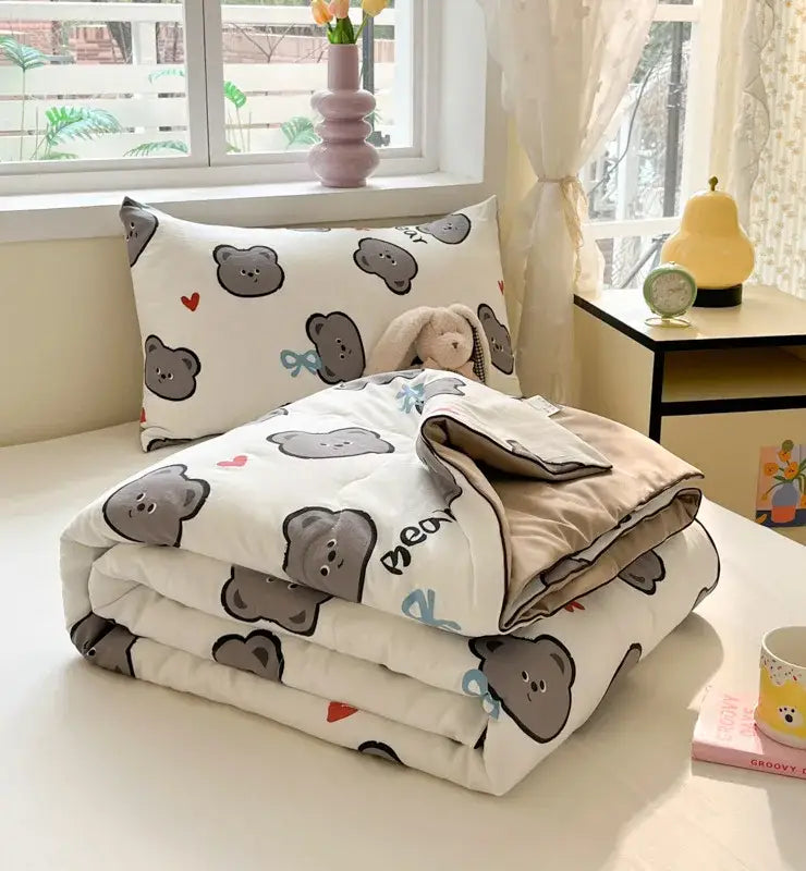 Cartoon printed white and yellow cooling blanket with gray bear and red heart patterns soft plush texture for summer use