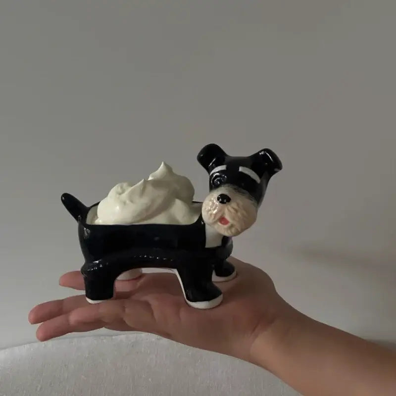 Black and white ceramic cartoon puppy schnauzer dog-shaped soap dish holding whipped cream for dining room decor