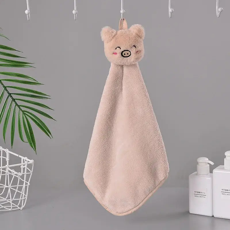 A soft blush-pink coral fleece hand towel with a cute pig face design for decorbites cartoon rabbit bathroom use