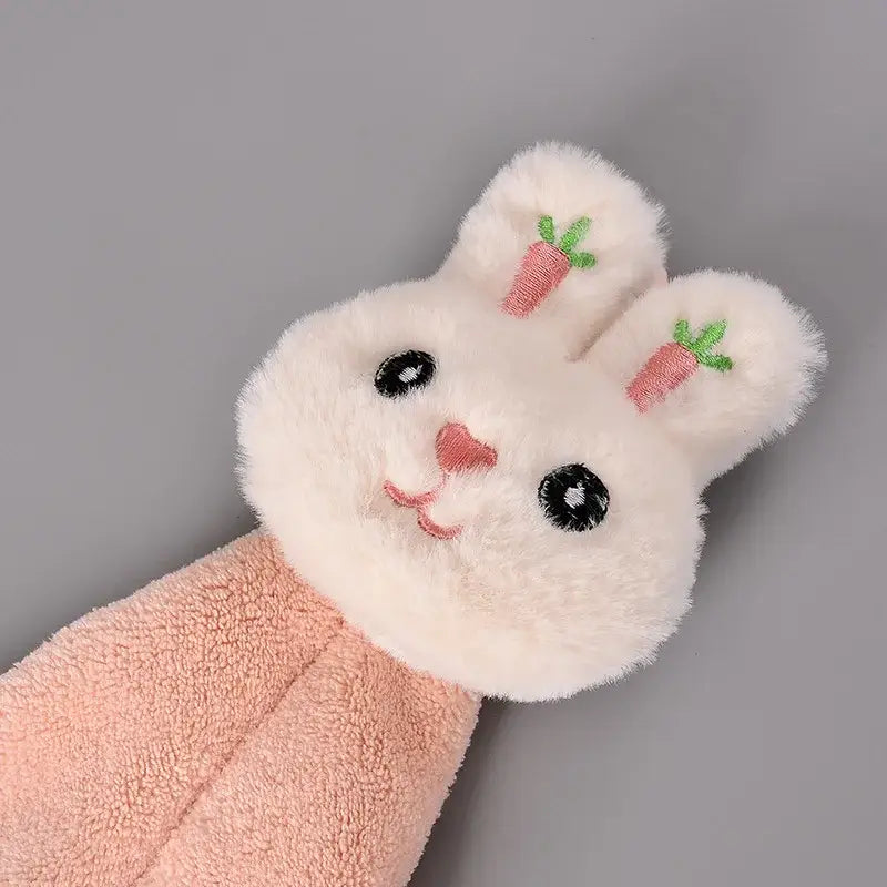 Soft white plush hand towel shaped like a cartoon rabbit with embroidered pink carrots and peach coral fleece body