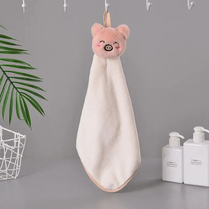 Soft plush pink pig-faced hand towel with fluffy texture and peach hanging loop from decorbites cartoon rabbit coral fleece collection