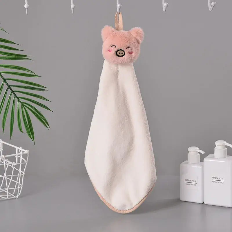 Soft plush pink pig-faced hand towel with fluffy texture and peach hanging loop from decorbites cartoon rabbit coral fleece collection
