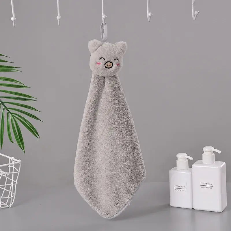 A soft gray coral fleece hand towel with a cartoon pig face design for quick dry bathroom use by decorbites cartoon rabbit