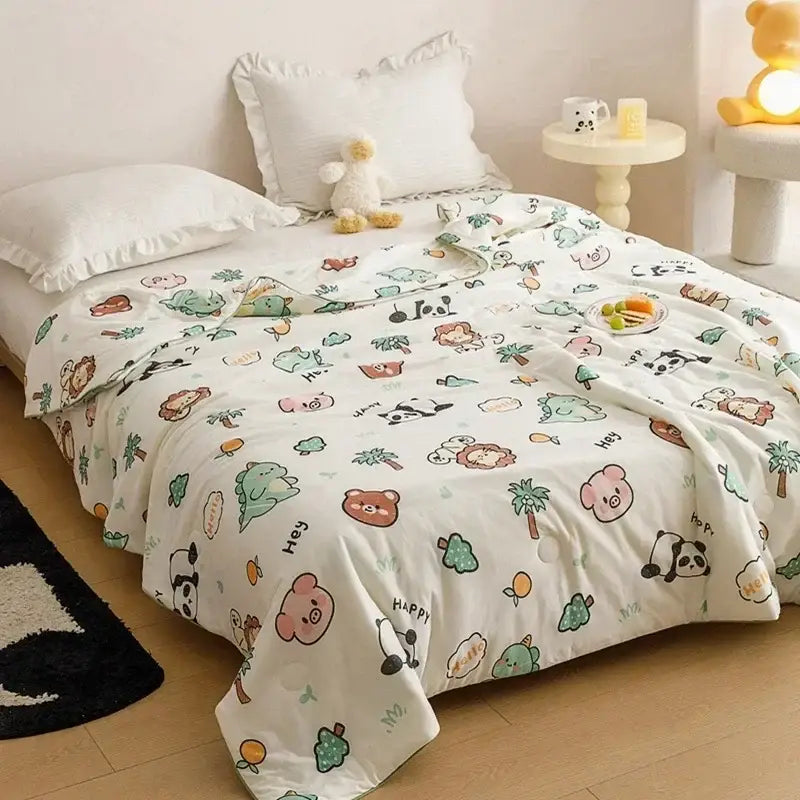 White duvet cover with cartoon animals and palm trees in pastel colors as a cooling summer blanket for bedroom